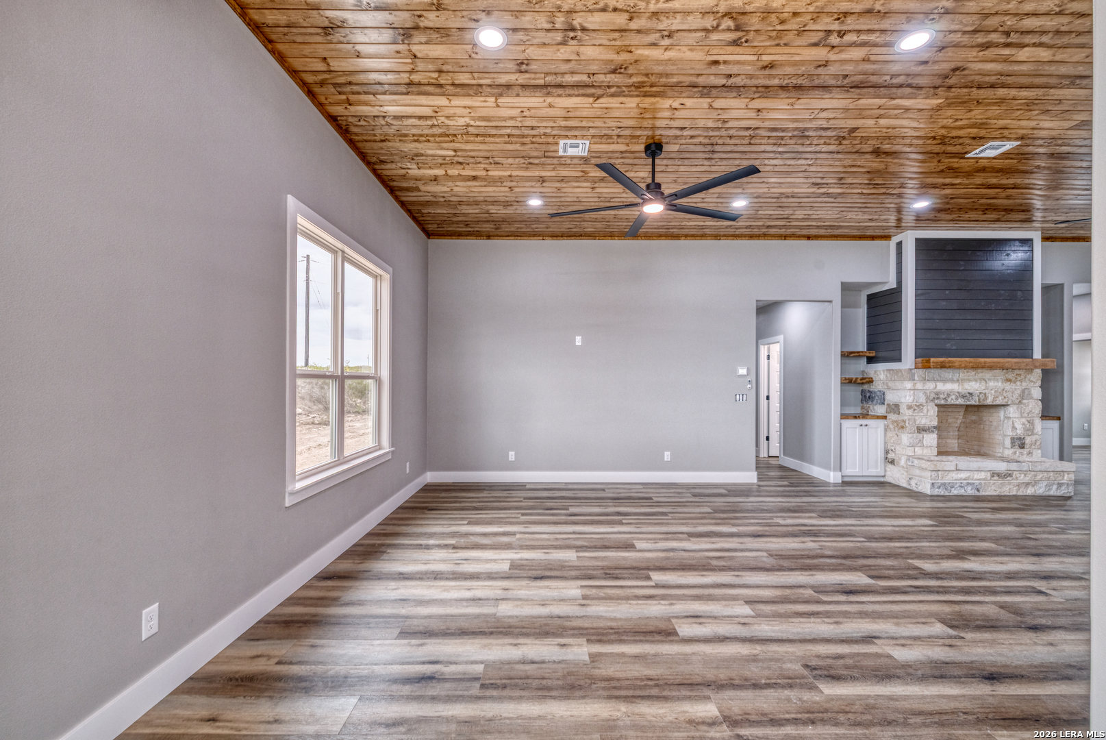 22 Greystone Hills Uvalde, TX 78801 - Photo 41 of 68 a view of a livingroom with wooden floor and windows
