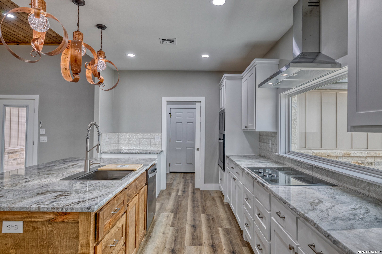 22 Greystone Hills Uvalde, TX 78801 - Photo 44 of 68 a kitchen with a sink a counter space and stainless steel appliances