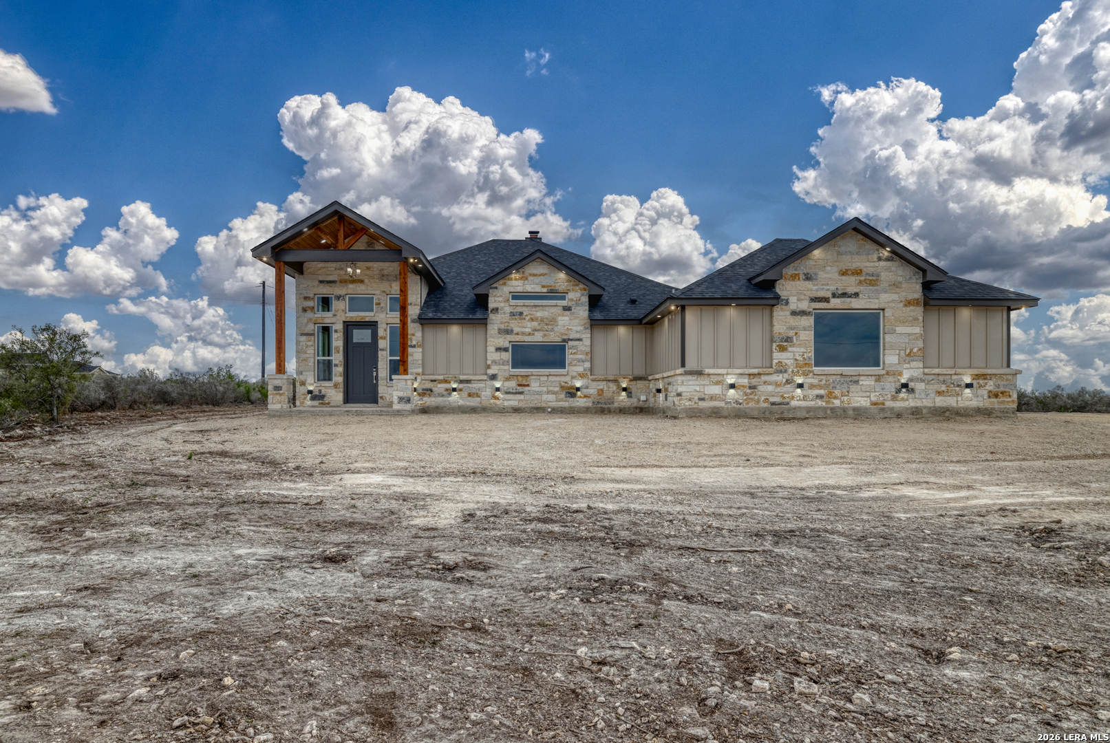 22 Greystone Hills Uvalde, TX 78801 - Photo 5 of 68 a front view of a house with a yard