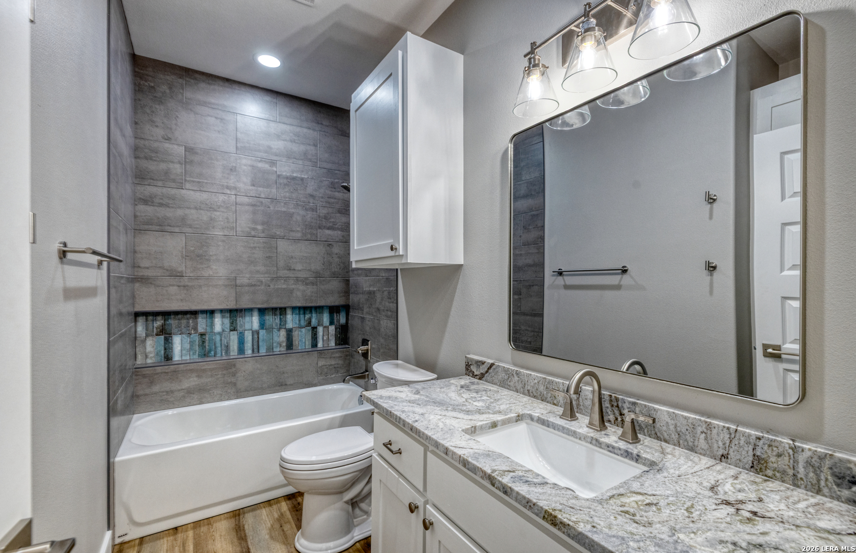22 Greystone Hills Uvalde, TX 78801 - Photo 61 of 68 a bathroom with a granite countertop sink toilet mirror and bathtub