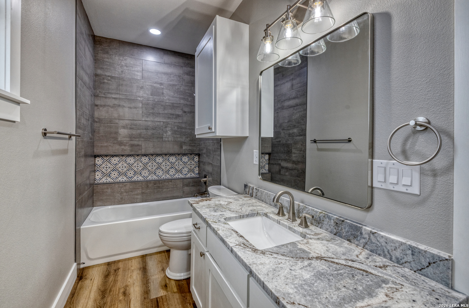 22 Greystone Hills Uvalde, TX 78801 - Photo 67 of 68 a bathroom with a granite countertop sink a toilet and bathtub