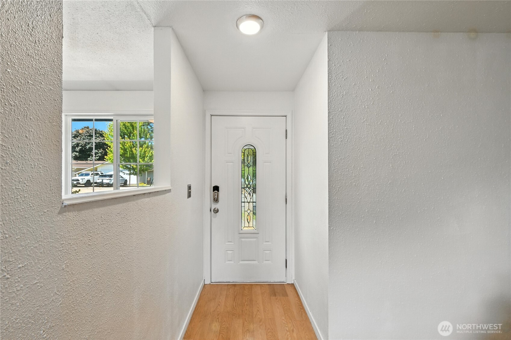 2102 35th Avenue Longview, WA 98632 - Photo 4 of 31 view of hallway with shower and wooden floor