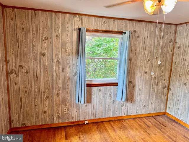 a view of front door with wooden floor