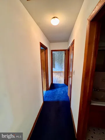 a view of room with window and hardwood floor