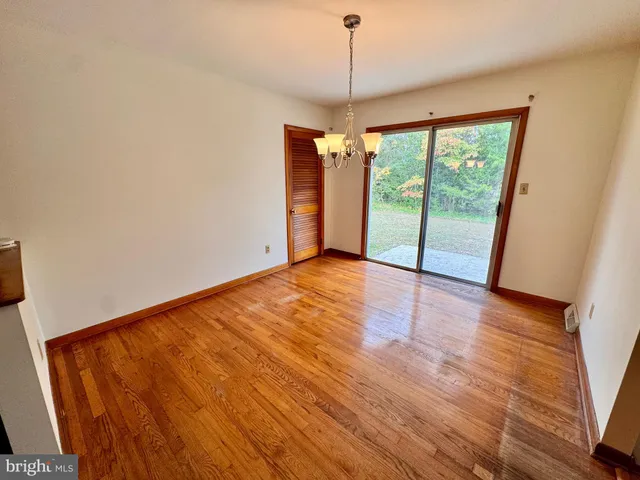 a kitchen with stainless steel appliances a stove a refrigerator and cabinets