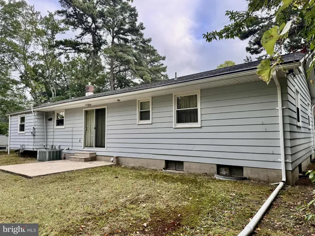 a backyard of a house with seating space