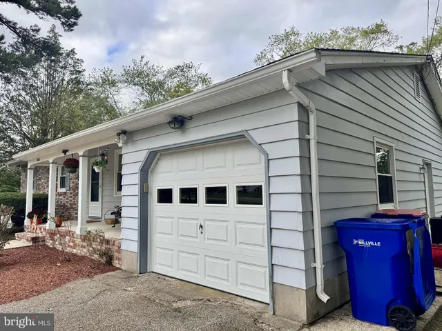 a view of a house with a backyard space