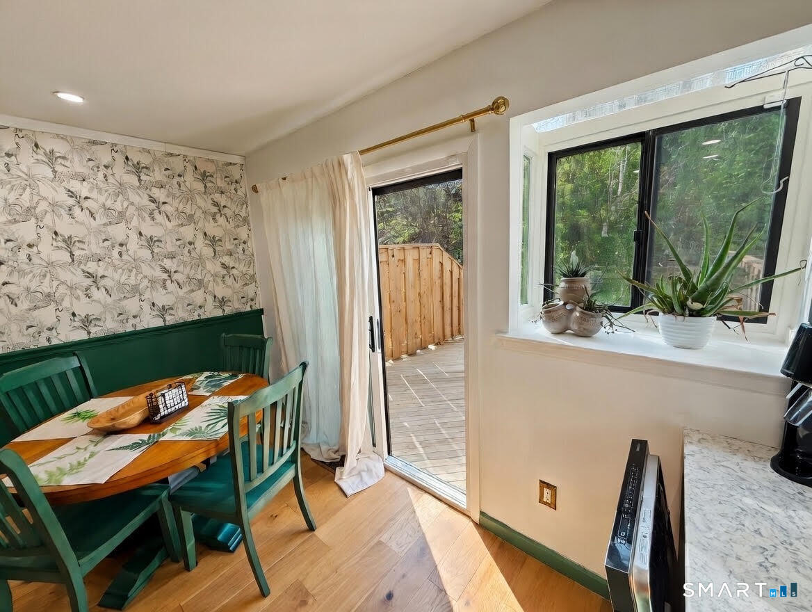14 Sunrise Hill Road, Unit 14 Norwalk, CT 06851 - Photo 12 of 23 a view of a living room and dining room with furniture
