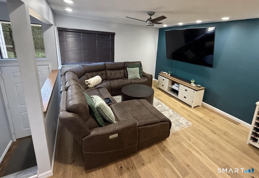 14 Sunrise Hill Road, Unit 14 Norwalk, CT 06851 - Photo 5 of 23 a living room with furniture and a flat screen tv