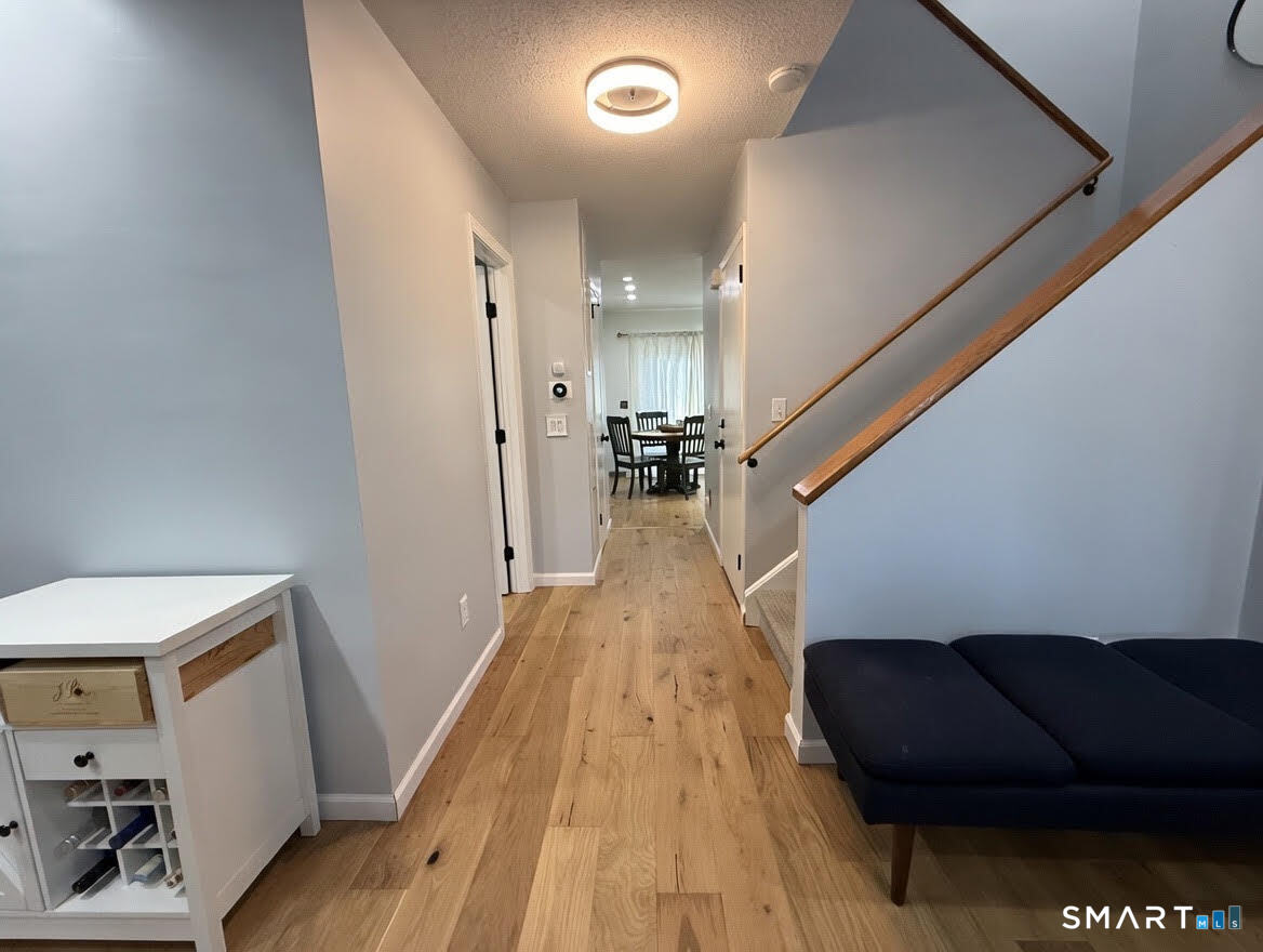 14 Sunrise Hill Road, Unit 14 Norwalk, CT 06851 - Photo 7 of 23 a view of entryway and hall with wooden floor