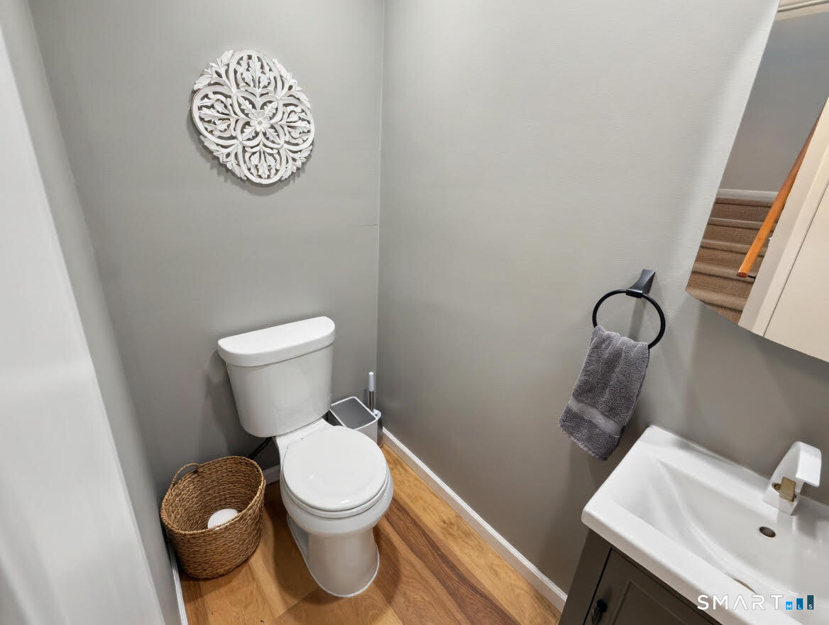 14 Sunrise Hill Road, Unit 14 Norwalk, CT 06851 - Photo 8 of 23 a white toilet sitting next to a bathroom sink