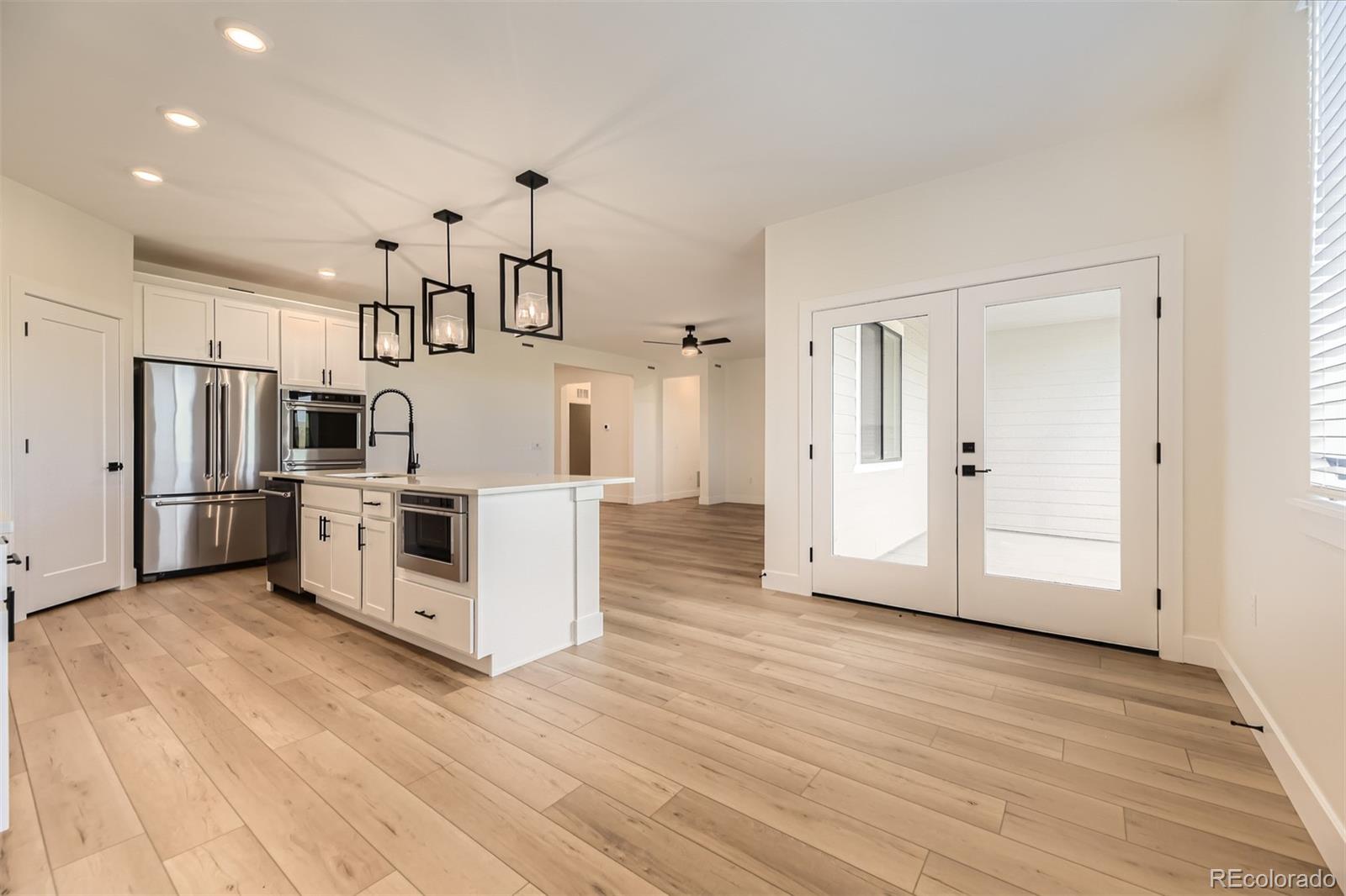 42979 Colonial Trail Elizabeth, CO 80107 - Photo 11 of 32 a view of a kitchen with refrigerator and an oven