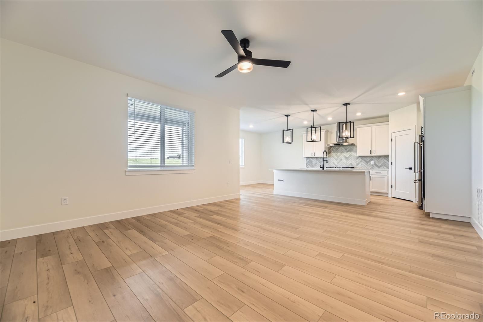 42979 Colonial Trail Elizabeth, CO 80107 - Photo 13 of 32 a view of a kitchen with wooden floor and a sink