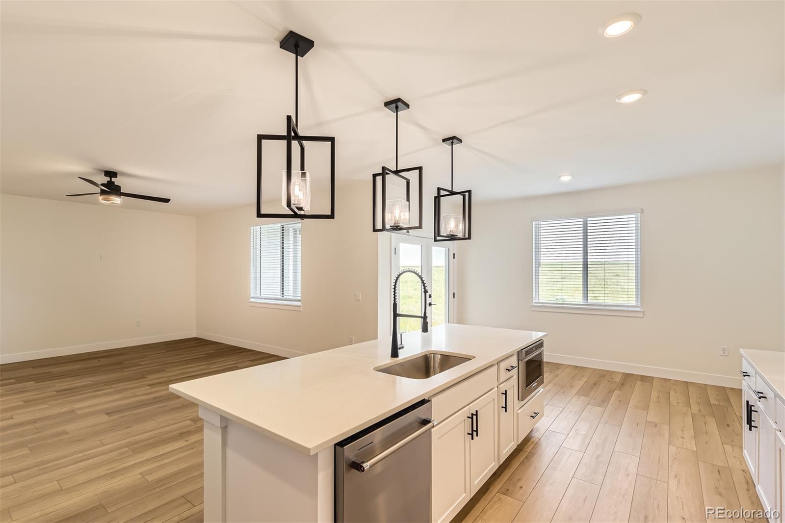 42979 Colonial Trail Elizabeth, CO 80107 - Photo 10 of 32 a kitchen that has a sink stainless steel appliances and cabinets