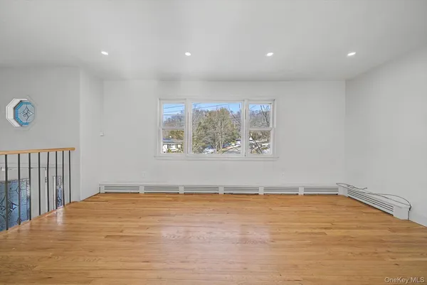 a kitchen with granite countertop a refrigerator and a stove top oven