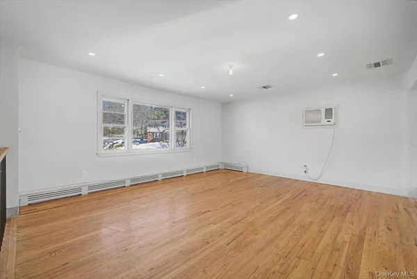 a bathroom with a sink and a large window