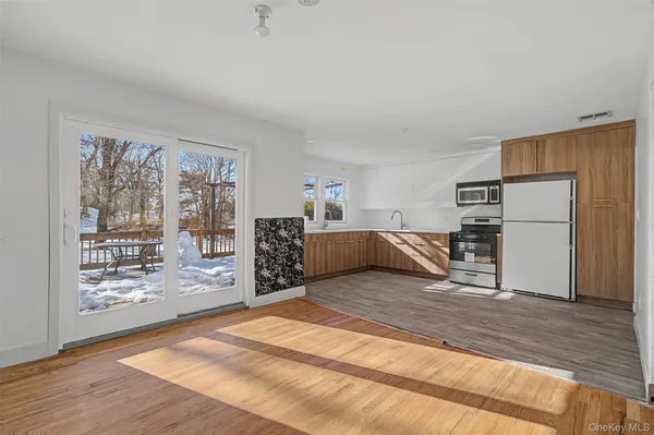 a bathroom with a sink and mirror with toilet