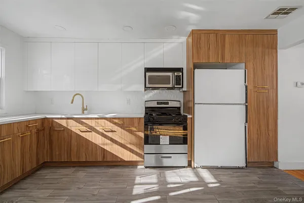 a bathroom with a toilet sink and shower