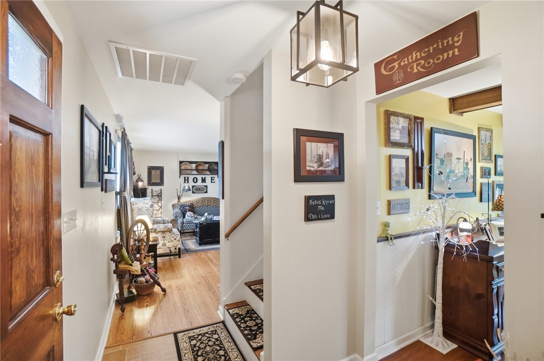 4170 Johnson Road Springfield, OH 45502 - Photo 10 of 54 A warm wooden entry door welcomes you to a comfortable interior with gleaming hardwood floors.