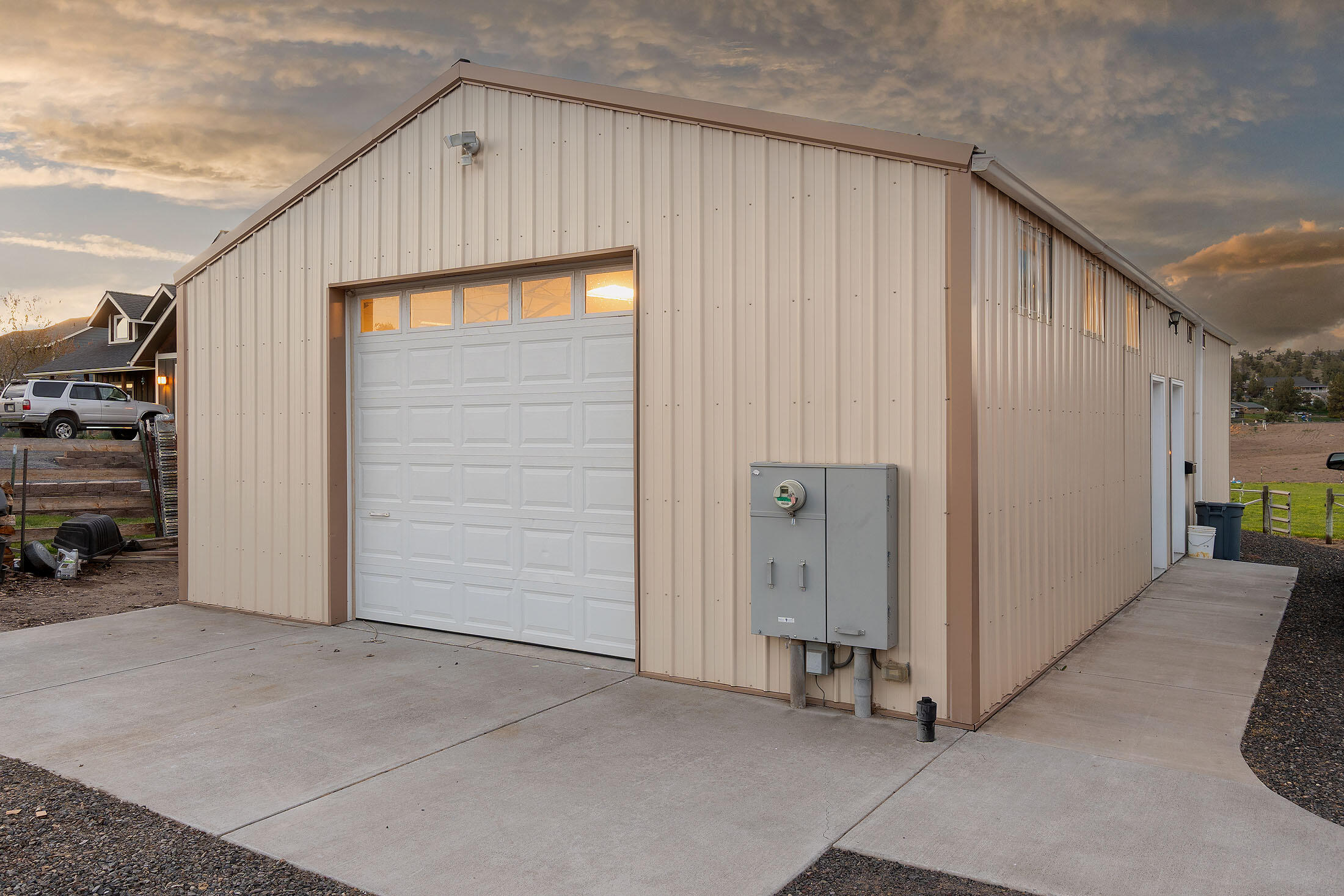 411 Northwest Mc Donald Road Prineville, OR 97754 - Photo 21 of 47 Shop with 9'x10' door, concrete pad and breezeway to the attached garage/residence.