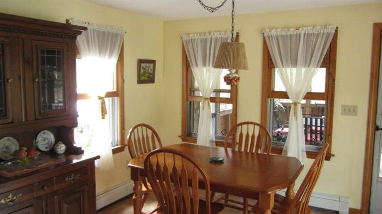 1495 Bridge Road Eastham, MA 02642 - Photo 8 of 21 a view of a dining room with furniture and window