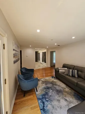a living room with furniture and a rug