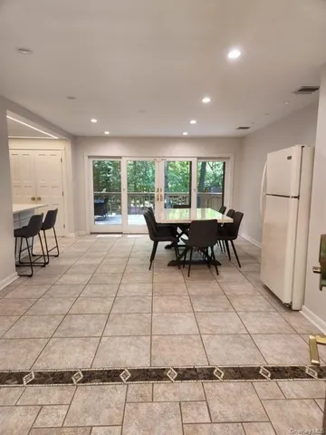 a living room with a large window and a table