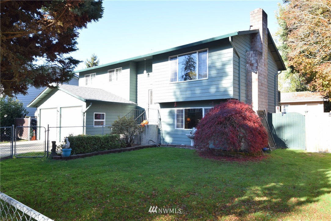 2631 166th Street Southeast Bothell, WA 98012 - Photo 1 of 18 a view of house with backyard