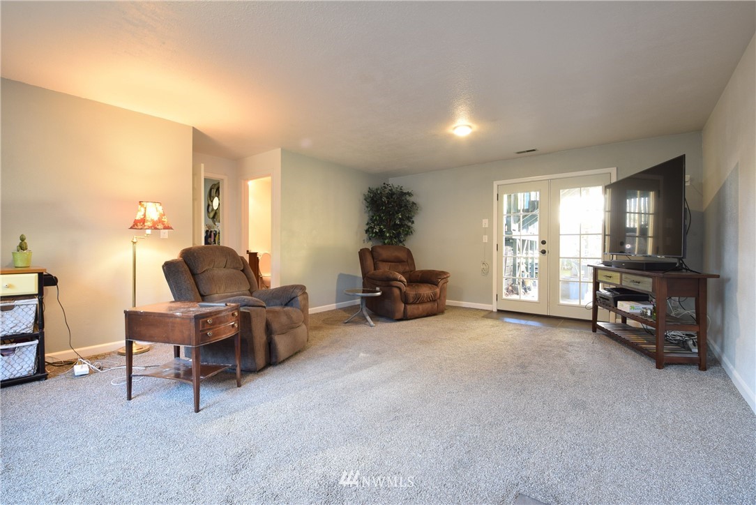 2631 166th Street Southeast Bothell, WA 98012 - Photo 12 of 18 a living room with furniture and a flat screen tv