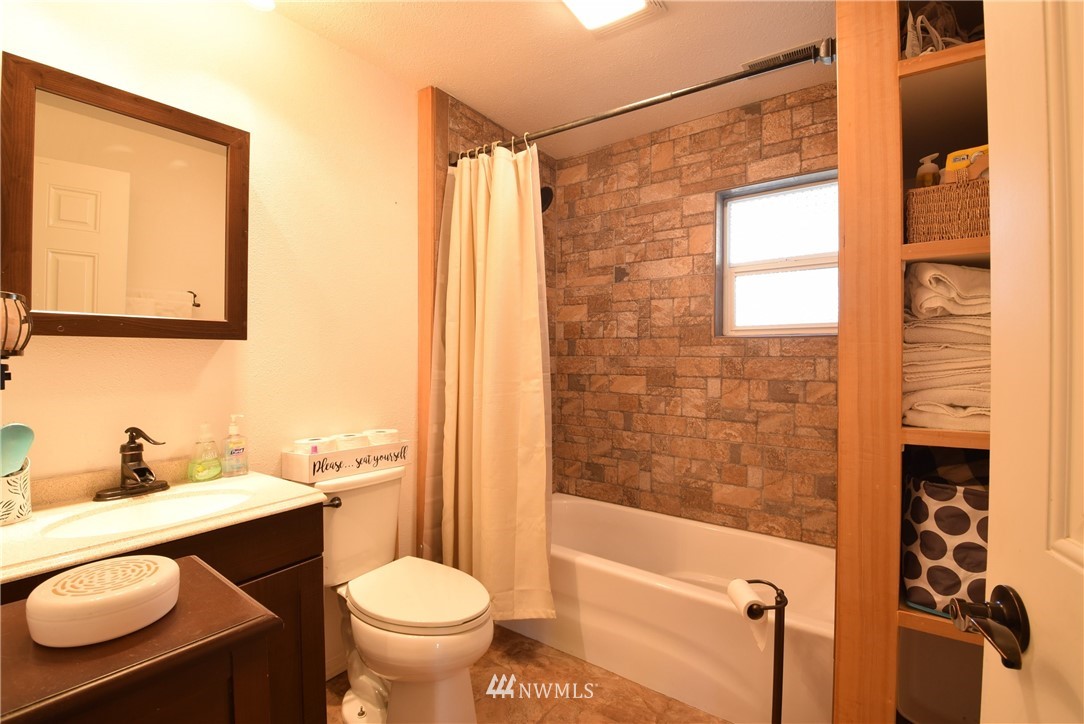 2631 166th Street Southeast Bothell, WA 98012 - Photo 13 of 18 a bathroom with a toilet a sink and a shower