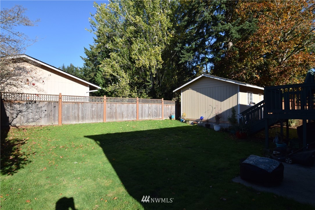 2631 166th Street Southeast Bothell, WA 98012 - Photo 17 of 18 a backyard of a house with lots of green space