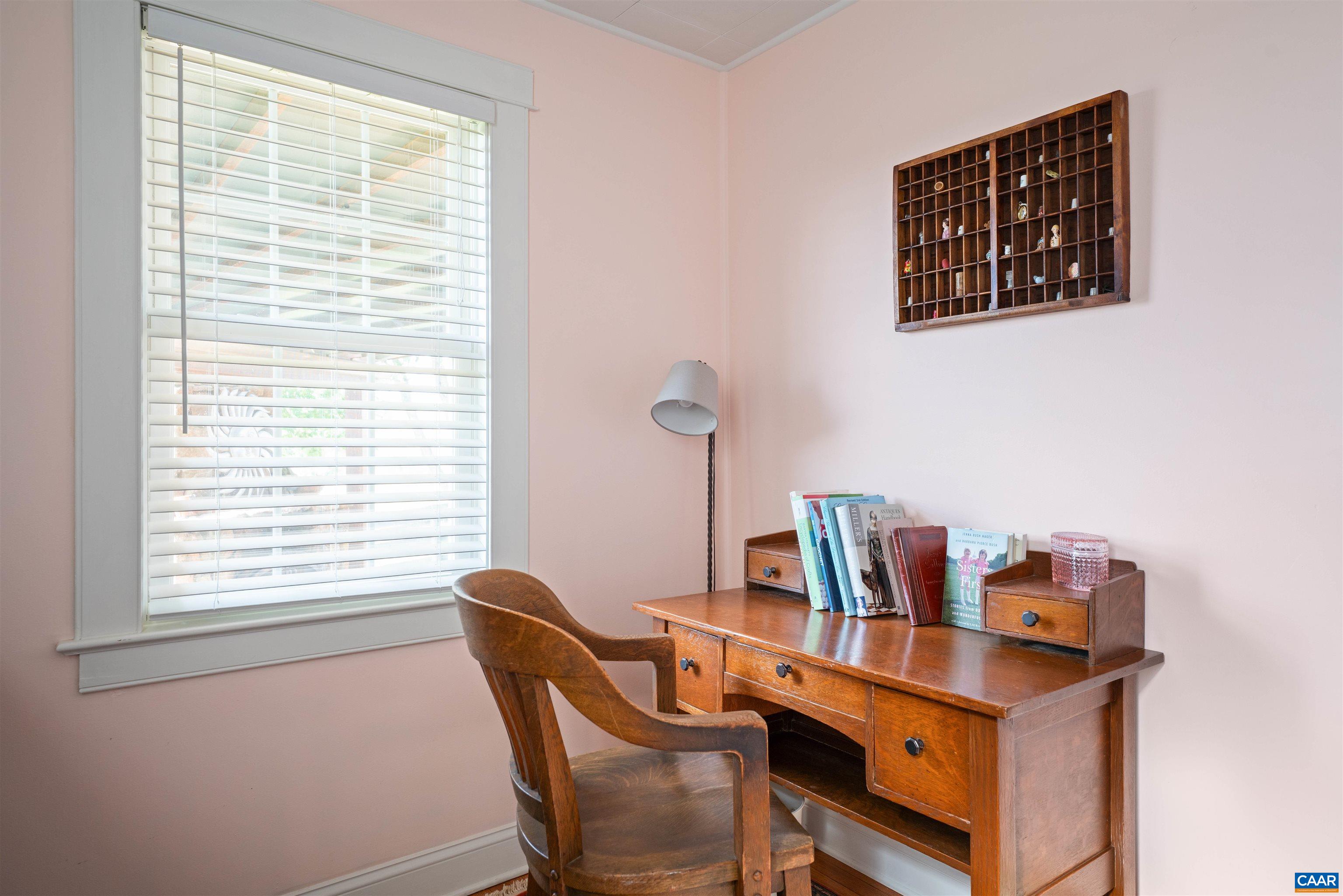 3486 Fredericksburg Road Ruckersville, VA 22968 - Photo 17 of 37 a view of a workspace with furniture and a window