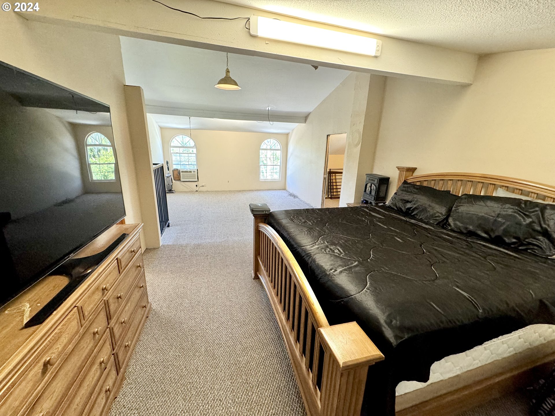 1463 Southside Road Sutherlin, OR 97479 - Photo 19 of 48 a bedroom with a bed and flat screen tv