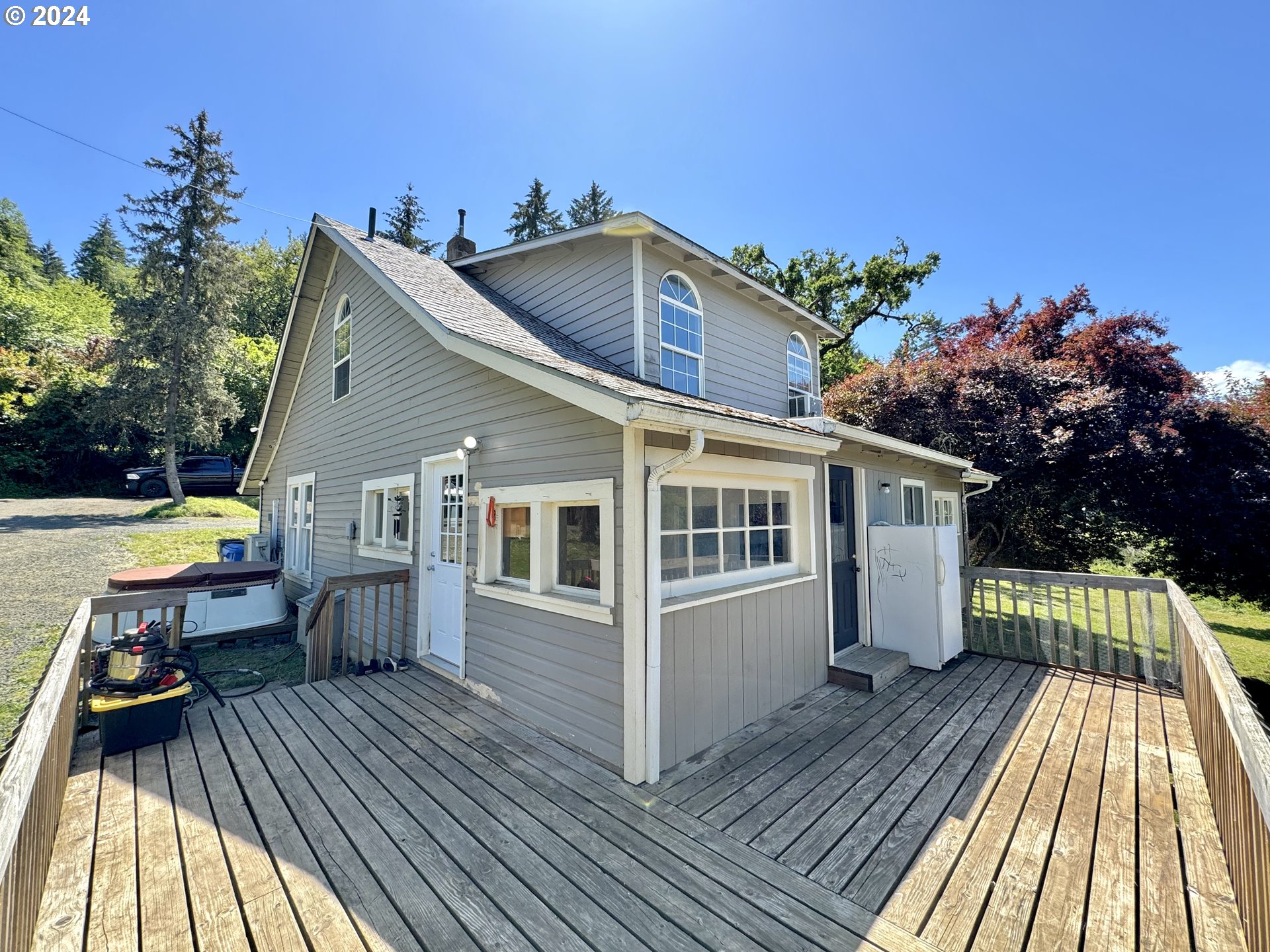 1463 Southside Road Sutherlin, OR 97479 - Photo 23 of 48 a view of house with deck outdoor seating and yard in back
