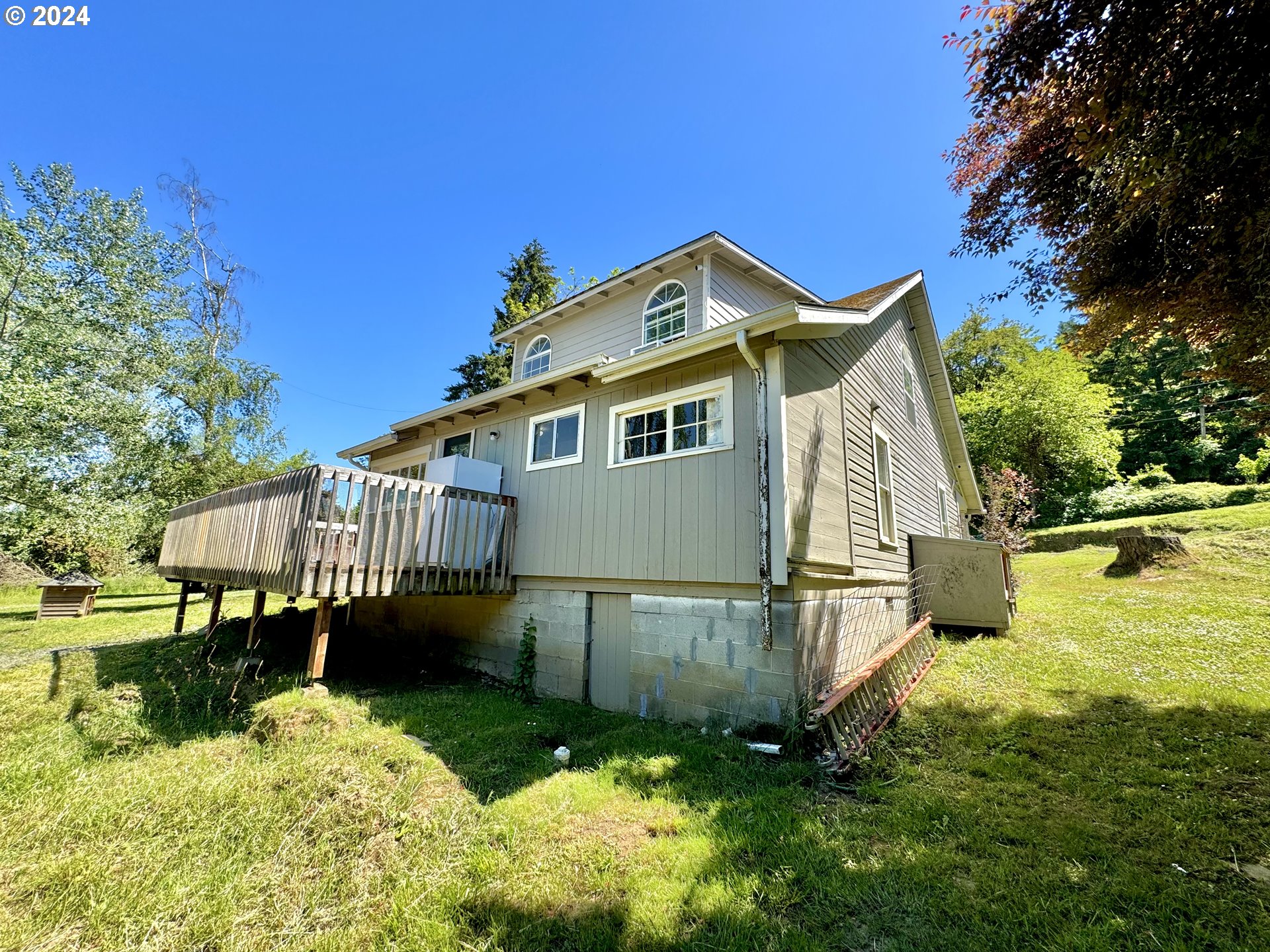 1463 Southside Road Sutherlin, OR 97479 - Photo 27 of 48 a view of a house with a yard deck and a garden