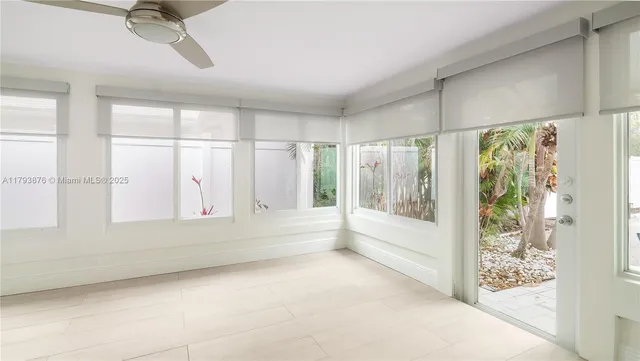 a view of an empty room with a balcony