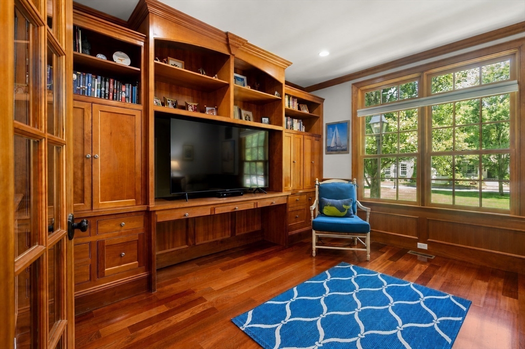 29 Maple Lane, Unit 29 Medfield, MA 02052 - Photo 15 of 42 a living room with furniture and a flat screen tv