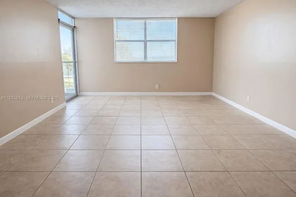 a view of an empty room with a window