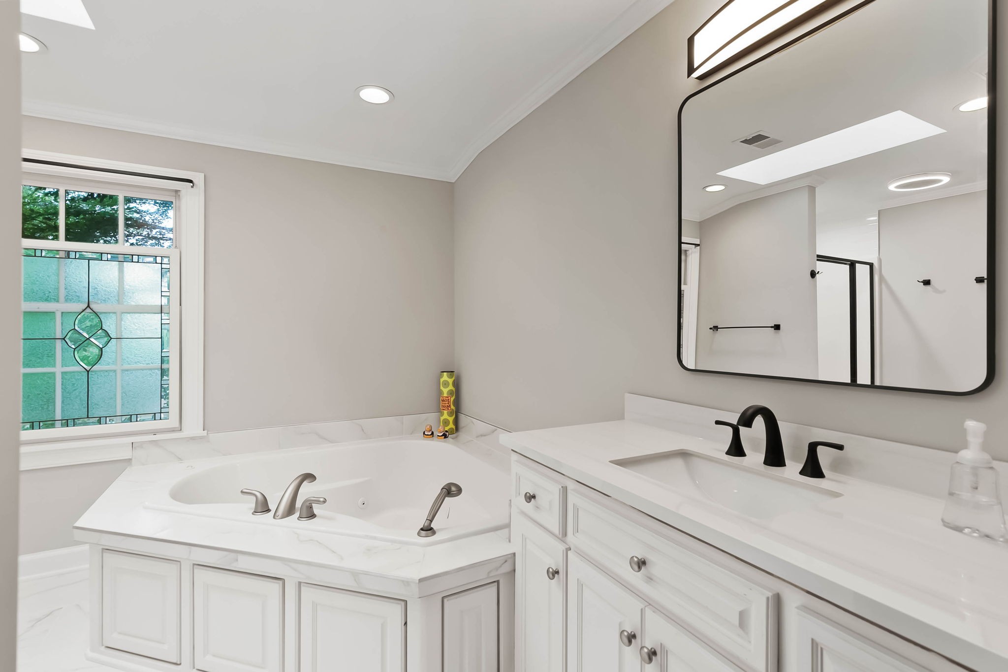 372 Perrolee Street Gallatin, TN 37066 - Photo 17 of 25 a bathroom with double vanity sinks and a mirror