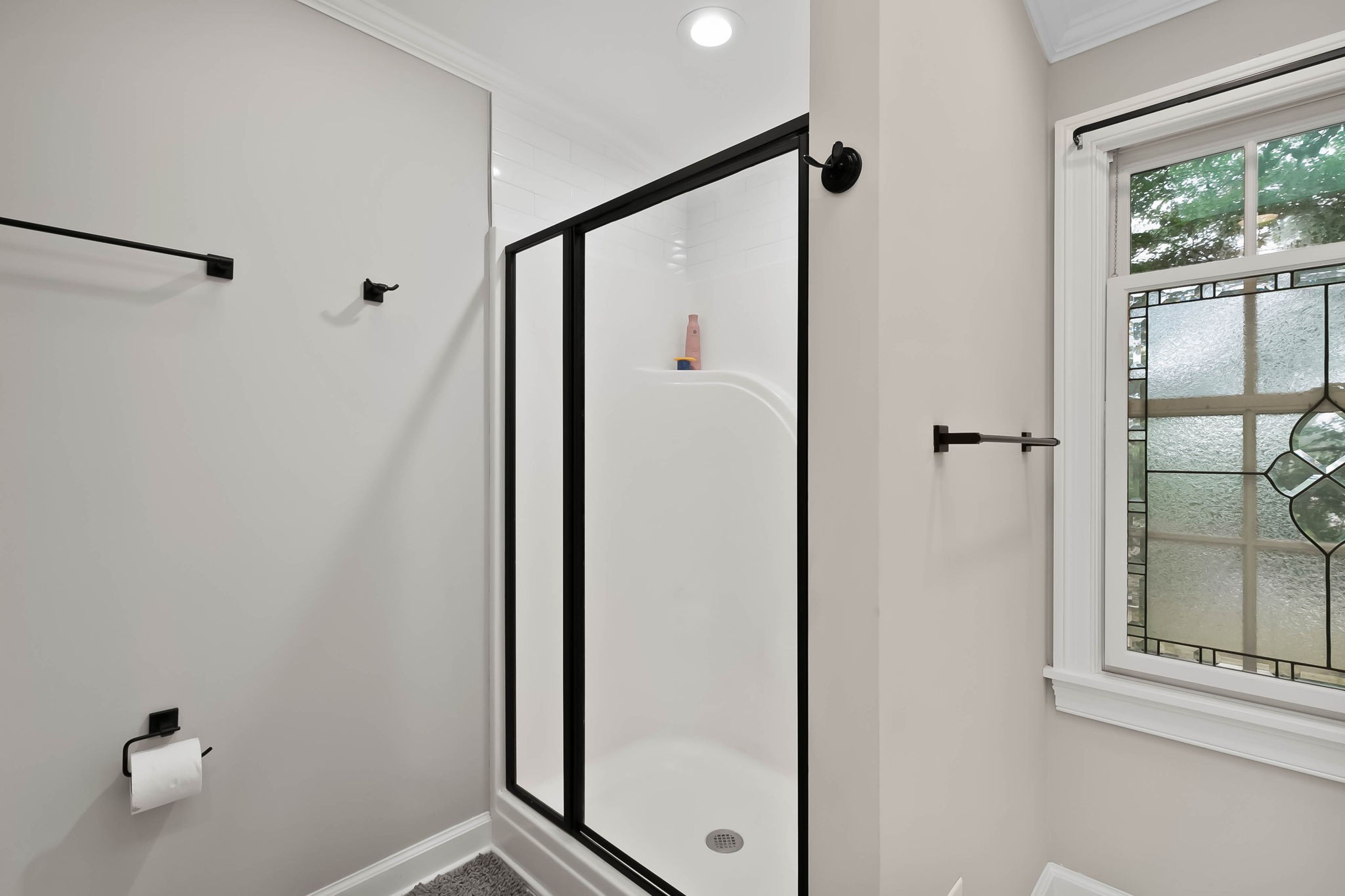 372 Perrolee Street Gallatin, TN 37066 - Photo 18 of 25 a bathroom with a shower and a mirror