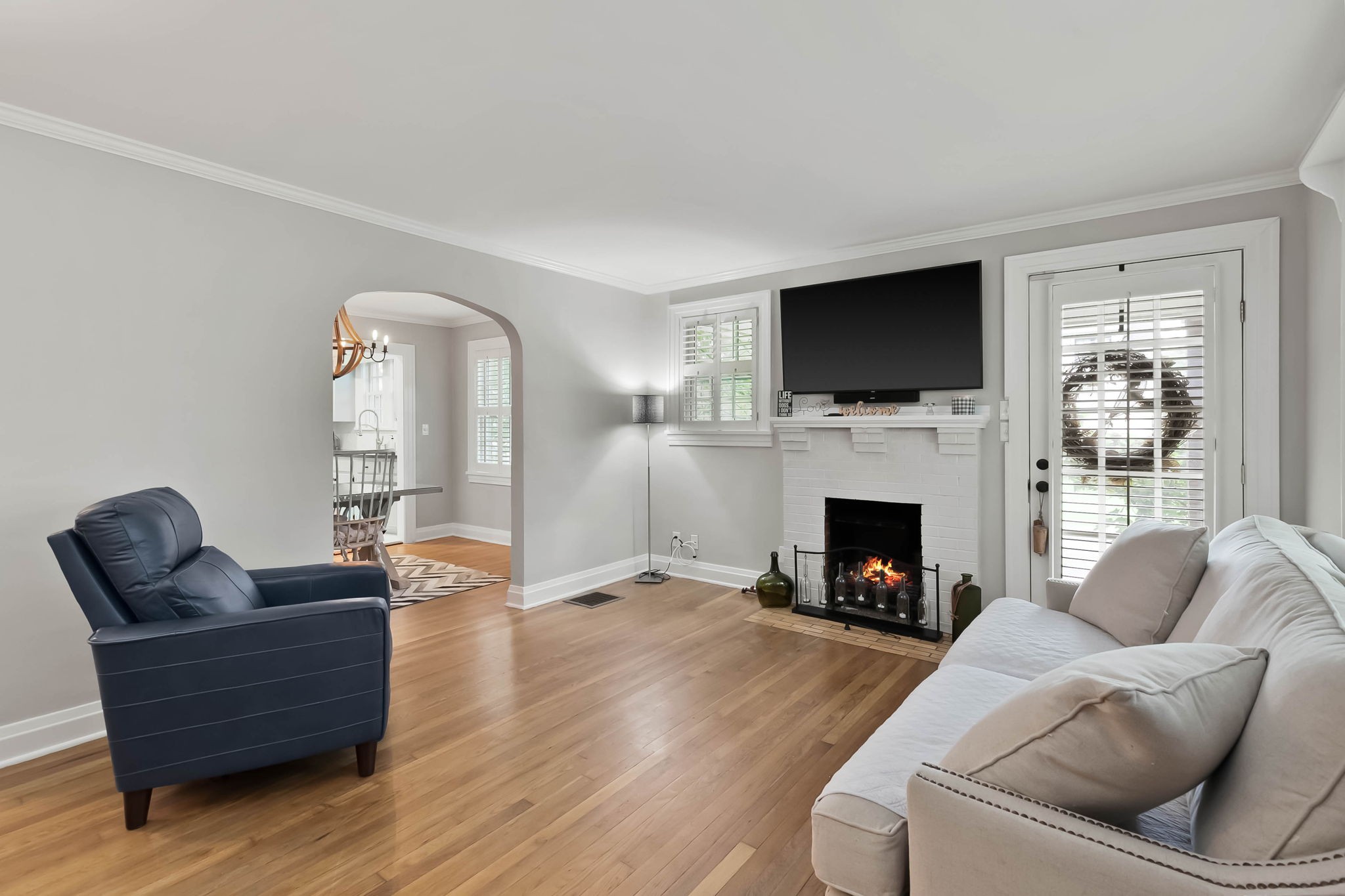 372 Perrolee Street Gallatin, TN 37066 - Photo 2 of 25 a living room with furniture a flat screen tv and a fireplace
