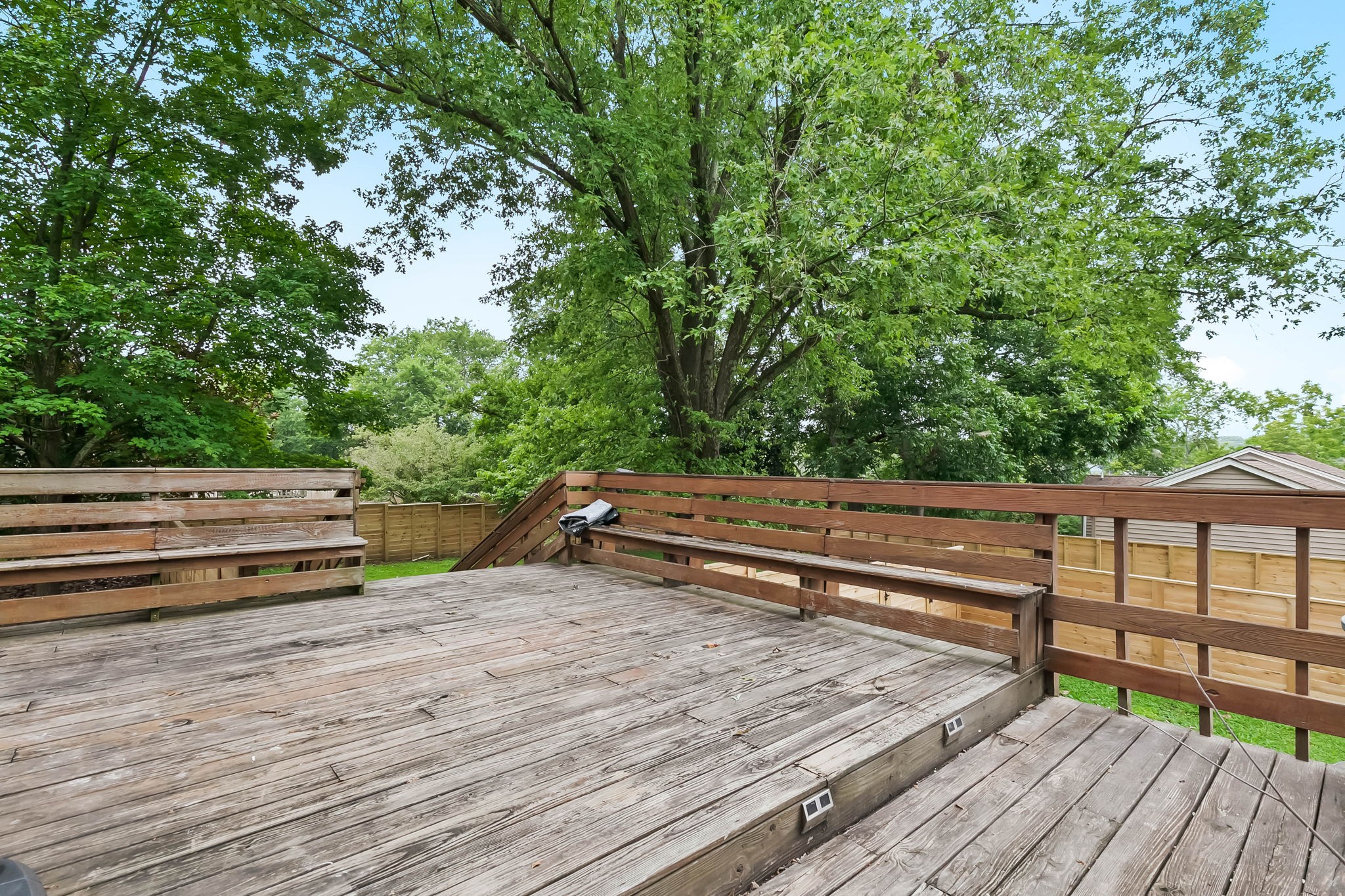 372 Perrolee Street Gallatin, TN 37066 - Photo 22 of 25 a bench sitting on top of a wooden roof deck