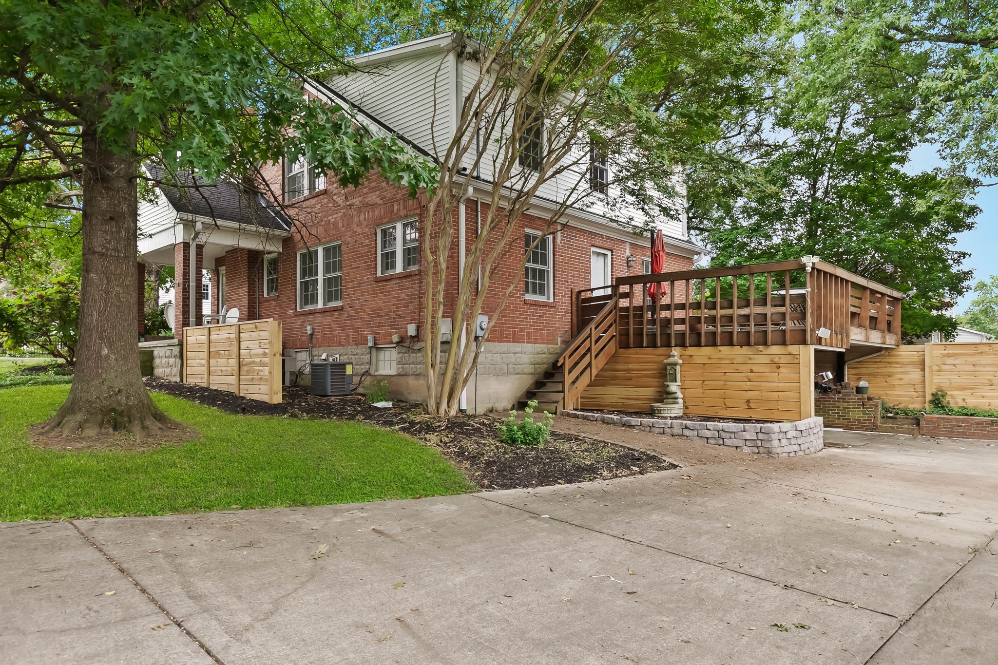 372 Perrolee Street Gallatin, TN 37066 - Photo 24 of 25 a view of a house with a small yard and a large tree