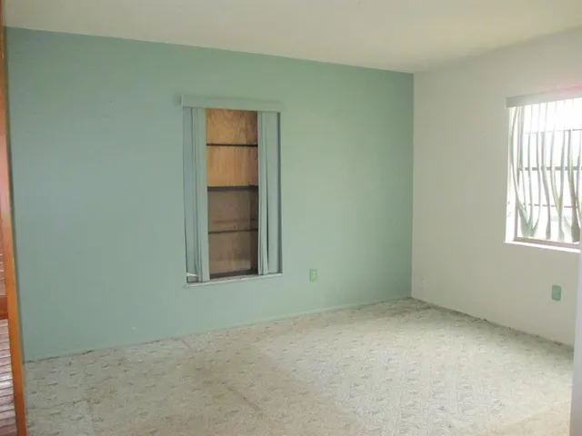 an empty room with windows