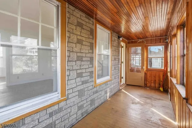 a view of an empty room with a fireplace