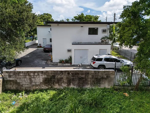 a car parked in front of a house