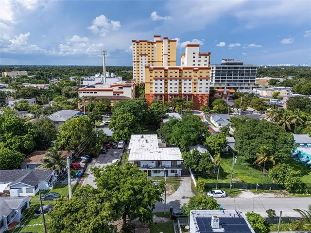 a view of a garden with an outdoor seating