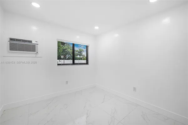a kitchen with a sink and a window