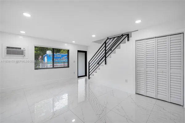 a view of entryway with stairs