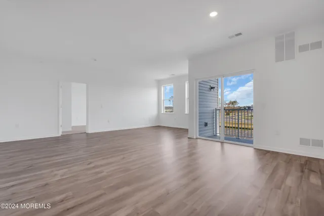 a kitchen with stainless steel appliances a refrigerator a stove a sink and a microwave